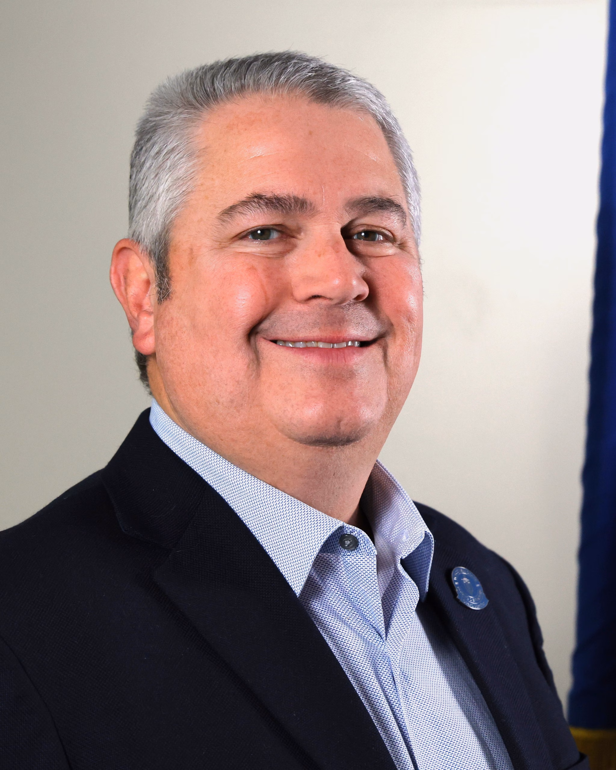 A headshot of SPD board member Joe Miotke